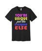 Unique Like Everyone Else graphic on a black Bella+Canvas 3001 tee