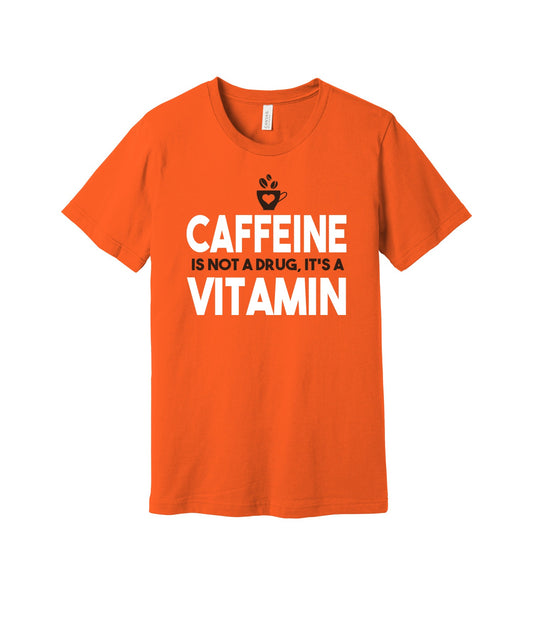 Caffeine Is a Vitamin graphic on a orange Bella+Canvas 3001 tee