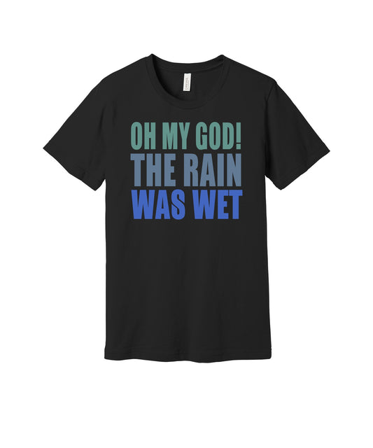 The Rain Was Wet graphic on a black Bella+Canvas 3001 tee