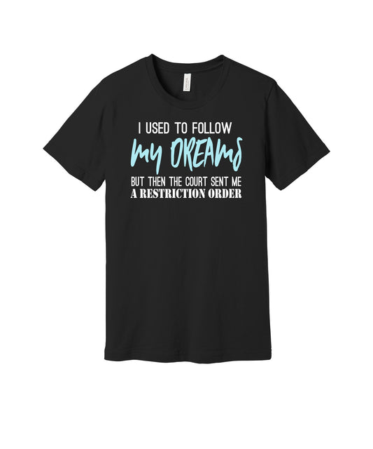 Following My Dreams graphic on a black Bella+Canvas 3001 tee