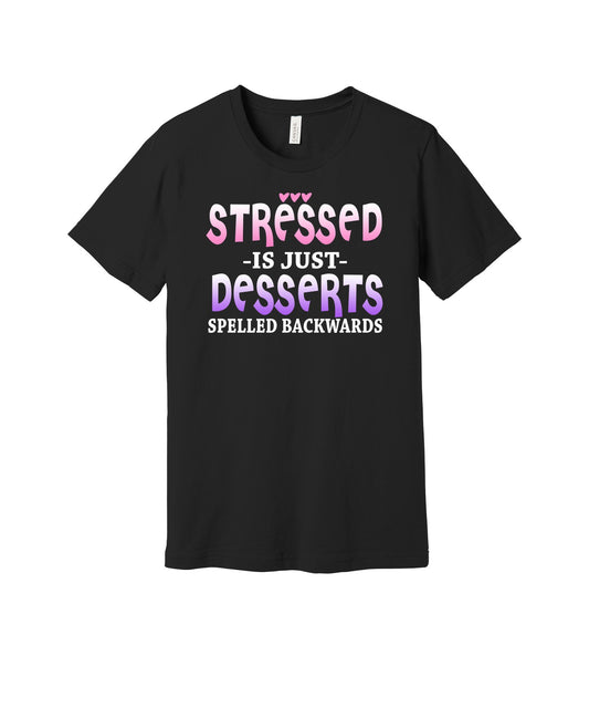 Stressed Is Desserts Backwards graphic on a black Bella+Canvas 3001 tee
