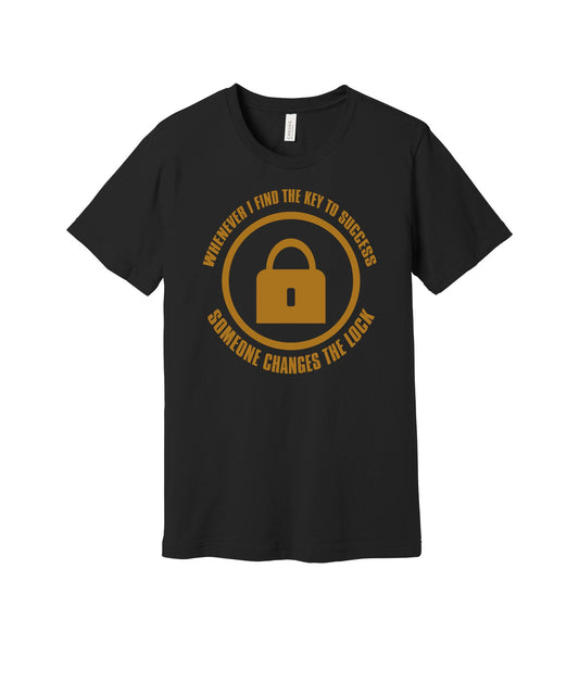 Key to Success Changed Locks graphic on a black Bella+Canvas 3001 tee