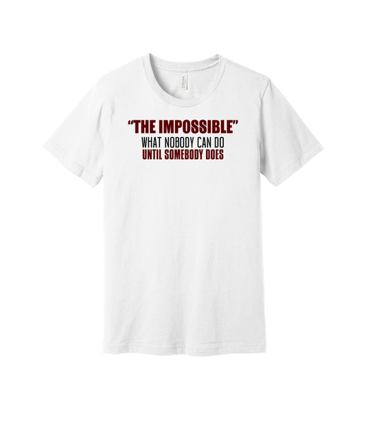 The Impossible Until Someone Does graphic on a white Bella+Canvas 3001 tee