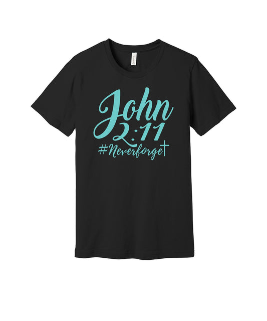 John 2:11 Never Forget graphic on a black Bella+Canvas 3001 tee