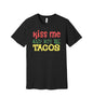 Kiss Me and Buy Me Tacos graphic on a black Bella+Canvas 3001 tee