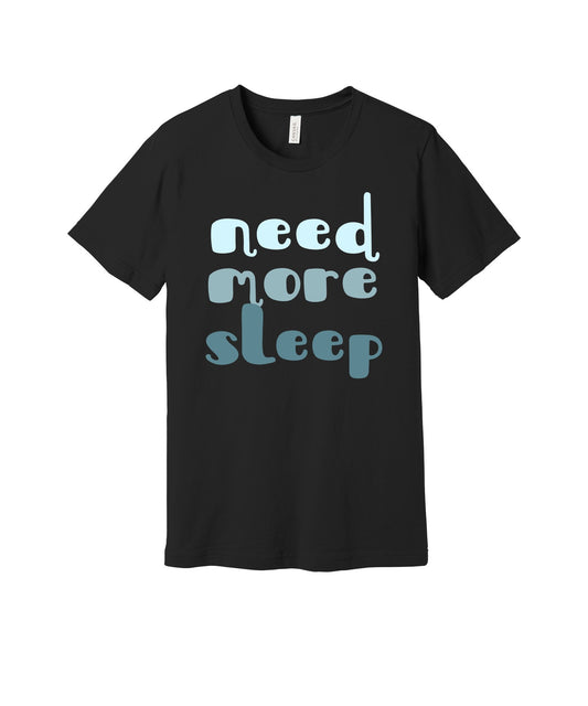 Need More Sleep graphic on a black Bella+Canvas 3001 tee